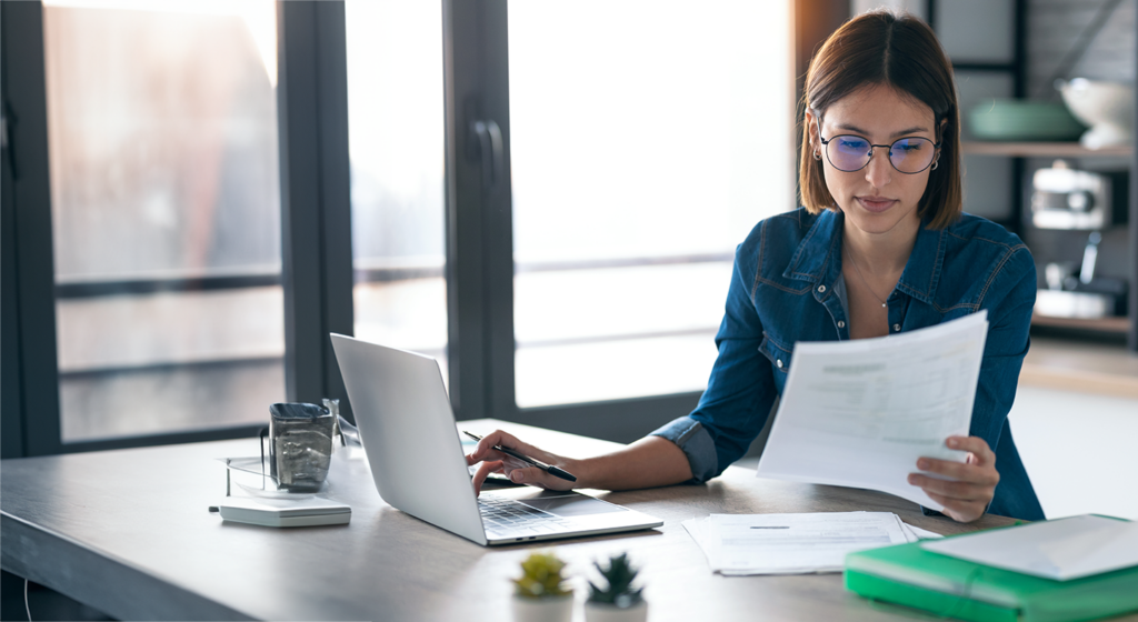 woman looking at an invoice