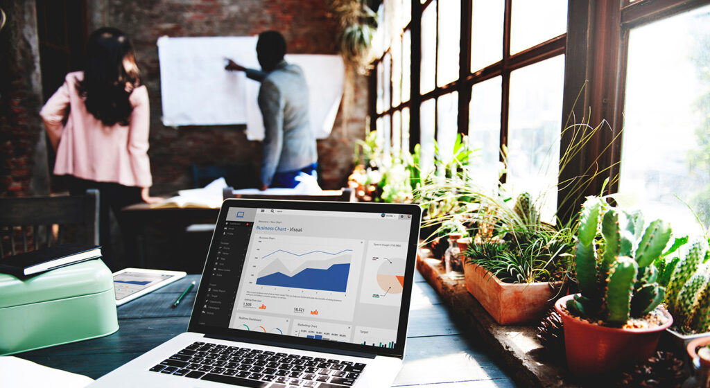 Laptop on desk showing financial scoring chart