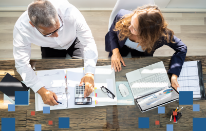 two workers reviewing paperwork together from a bird's eye view