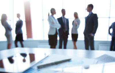 people standing around and talking in a business setting
