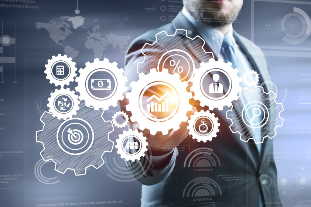 Man in a suit, with a graphic of various financial icons in the foreground.