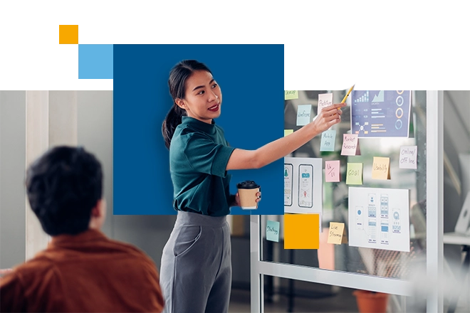 woman pointing to data and results on a whiteboard