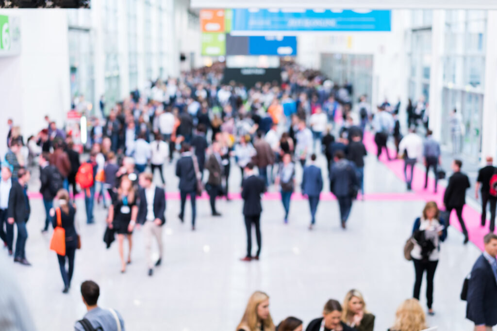 Trade show crowd walking through a wide hallway at a DataServ Accounts Payable Automation event